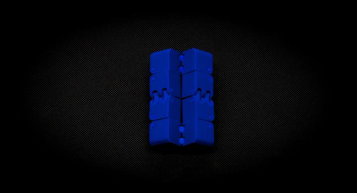 Blue fidget cube folded out, hinges visible