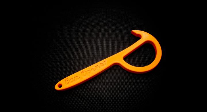 Orange p-shaped can opener with a hook on top to pull up tabs